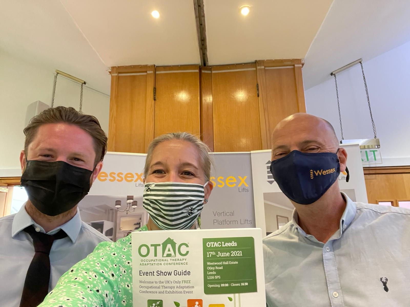 A selfie of the sales team in front of their stand at the OTAC show, Leeds, 2021.