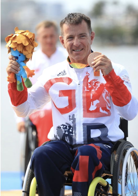 Ian, happily holding his bronze medal.