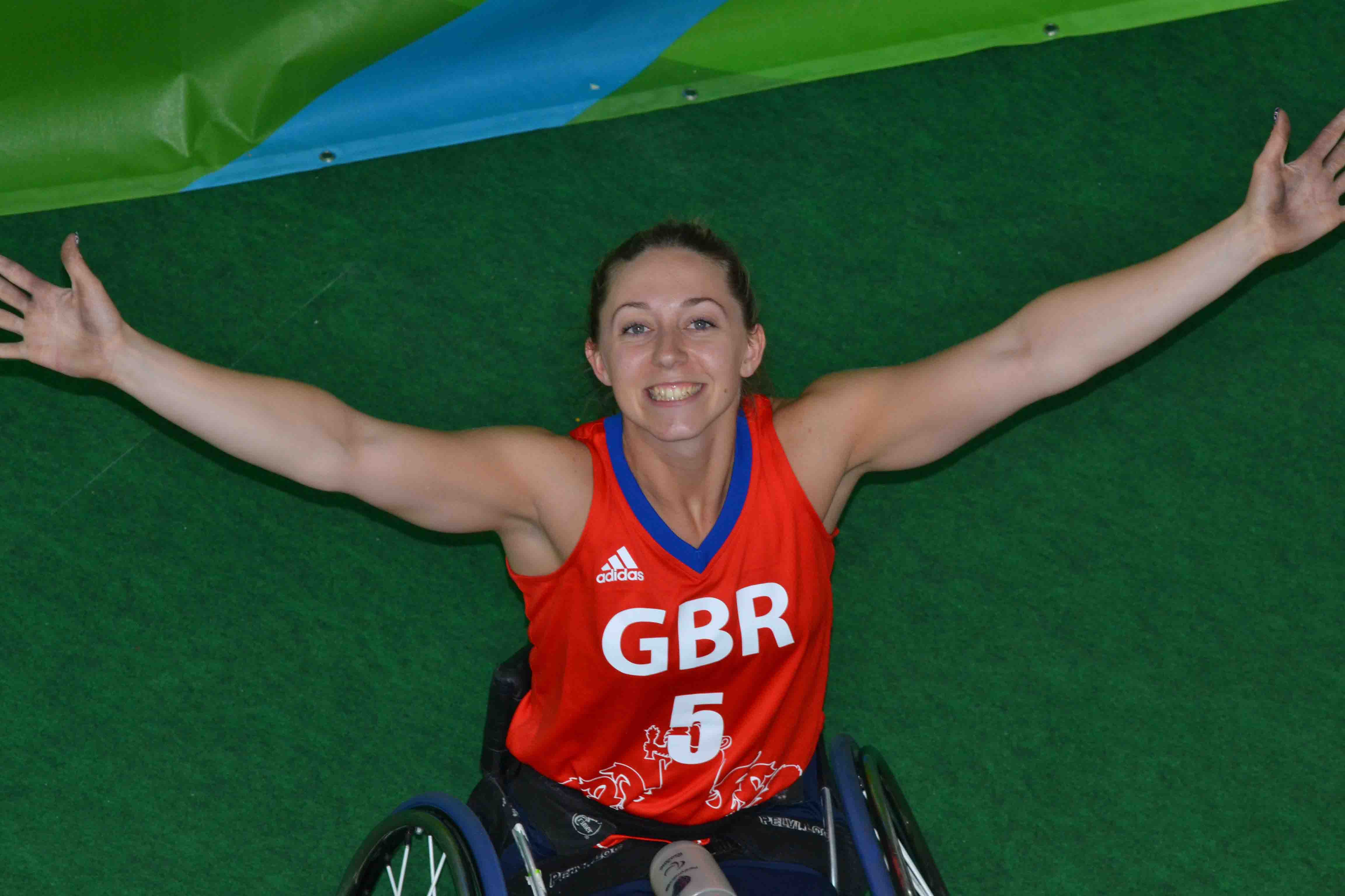 Aerial view of Sophie with her arms extended, smiling!